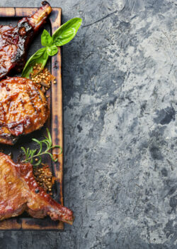Spicy meat grilled spare ribs on wooden cutting board