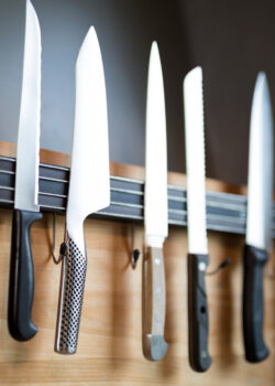 Close-up of kitchen knives hanging on the wall